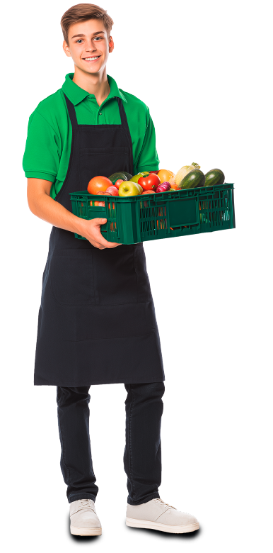 Junger Mann mit Schürze und einer Obstkiste in der Hand